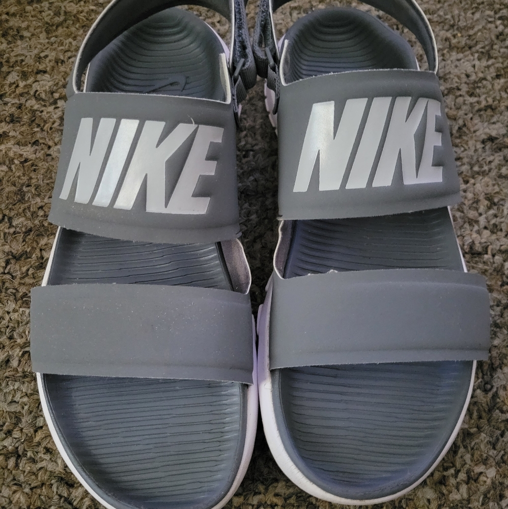 Gray Nike sandals with straps